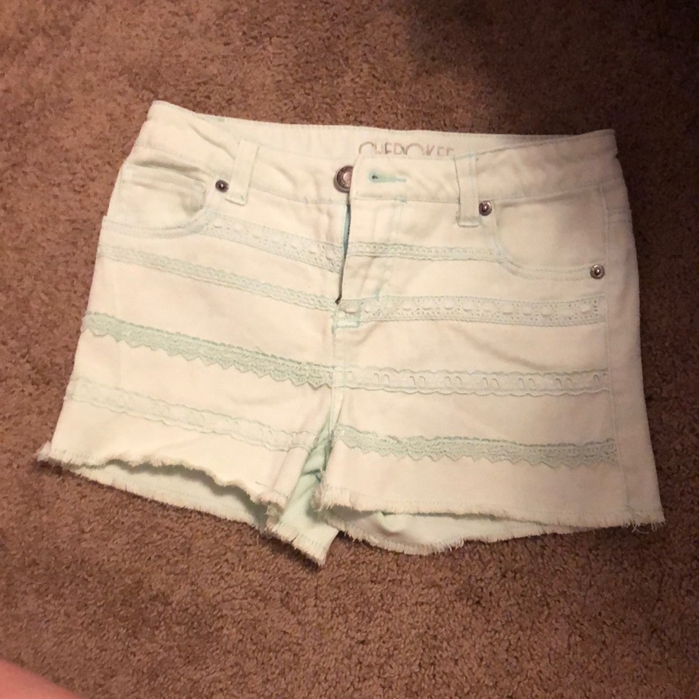 Girls making green blue Jean shorts